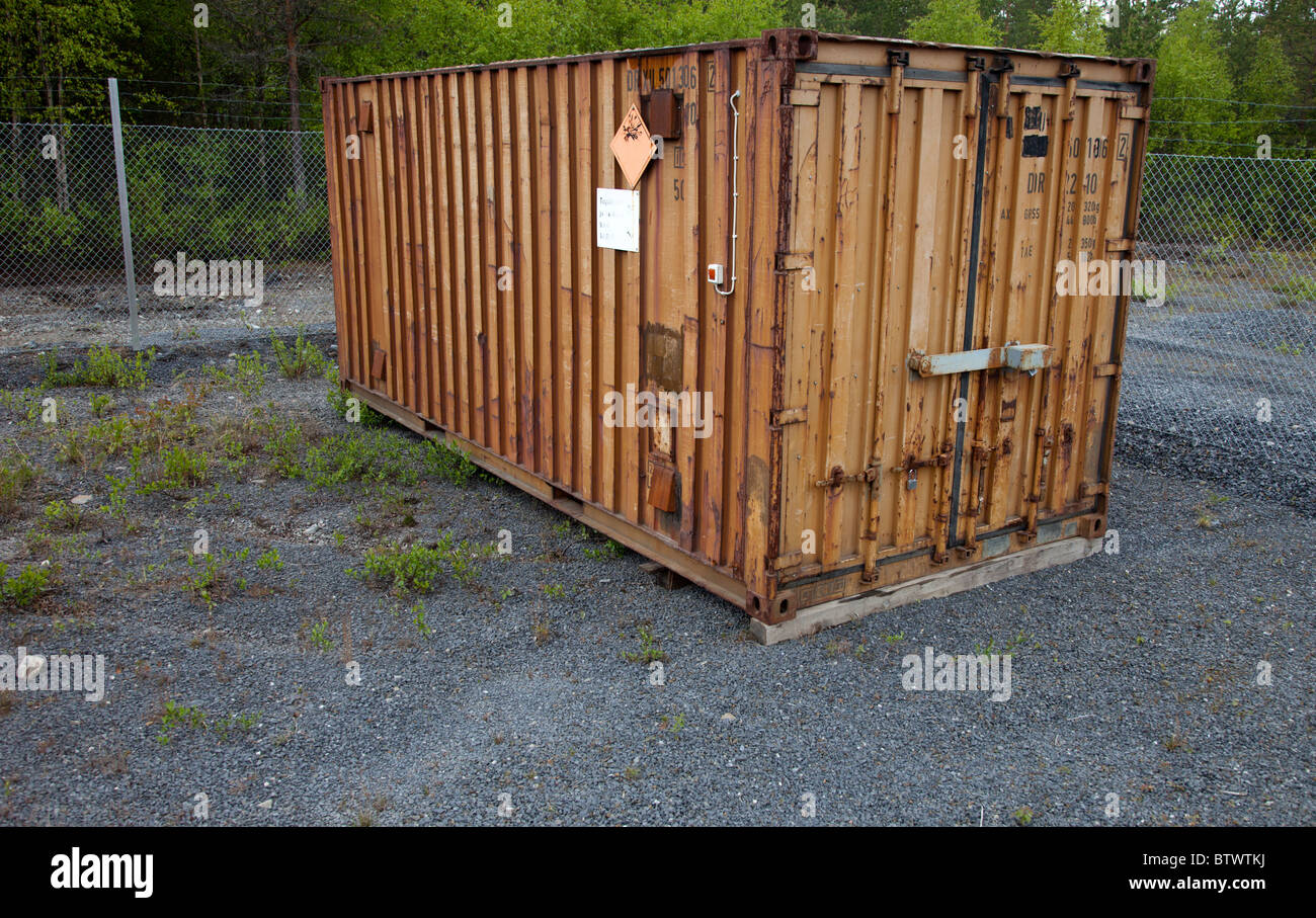 Rusty brown shipping container full of explosives , Finland Stock Photo