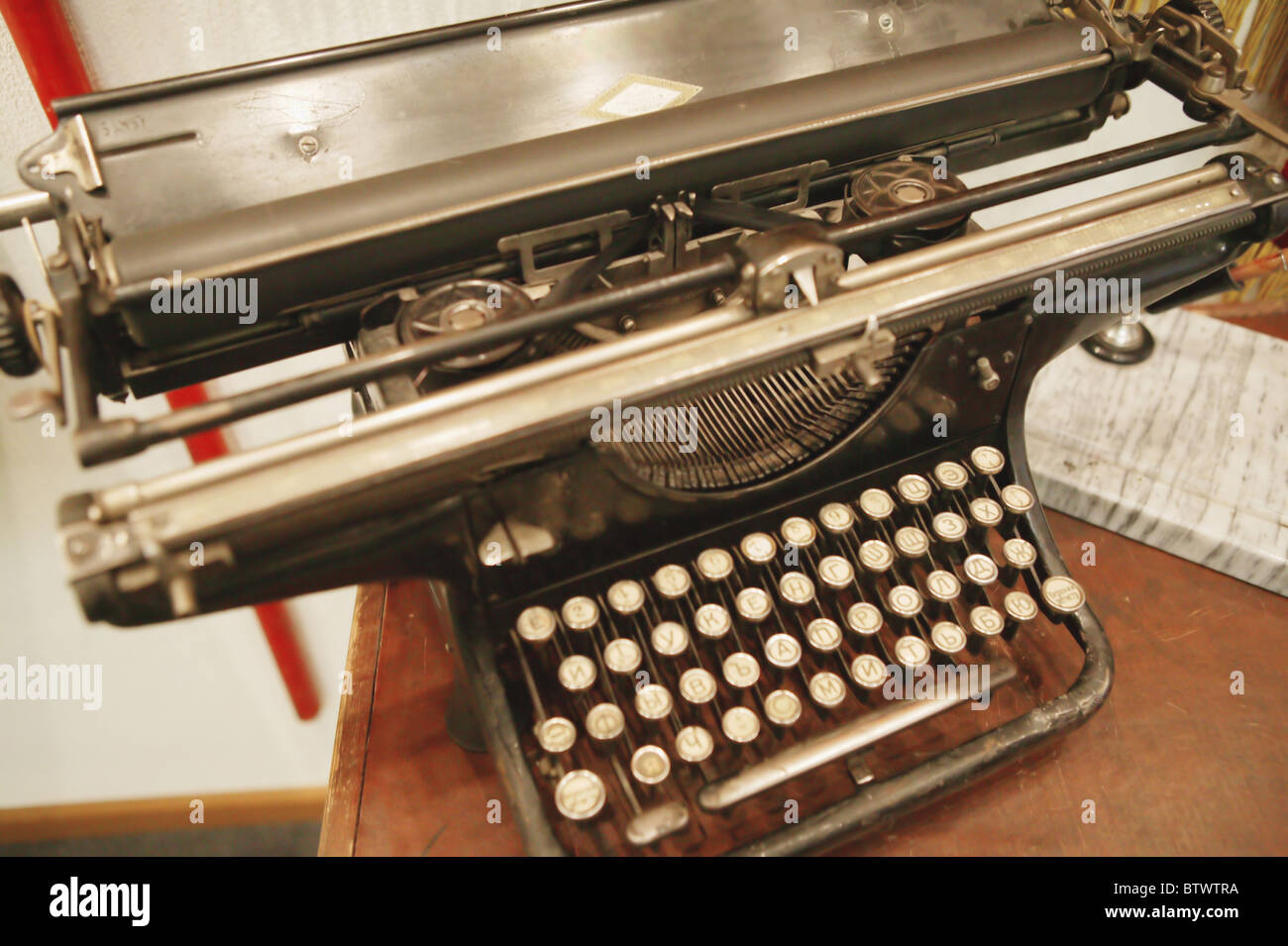 A printing press is a mechanical device for applying pressure to an