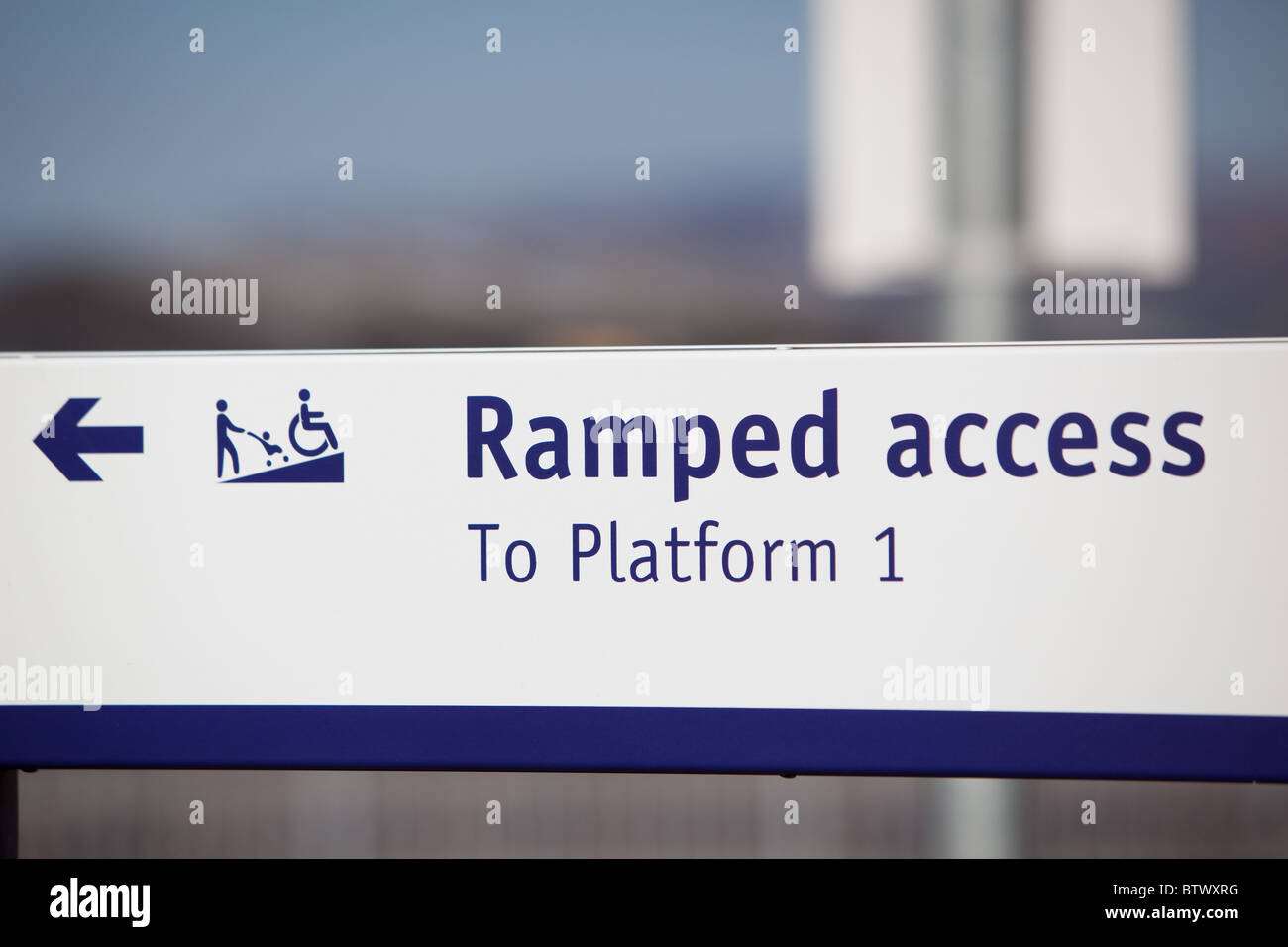 modern railway station signs for ramped access for prams and for those with disabilities Stock Photo