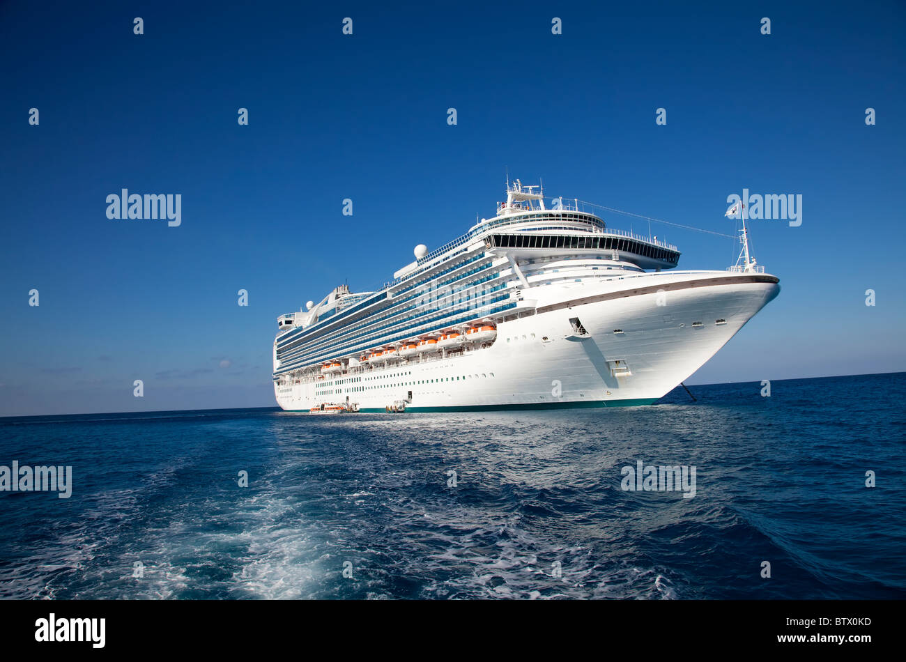 Cruise ship anchored in Caribbean sea Stock Photo
