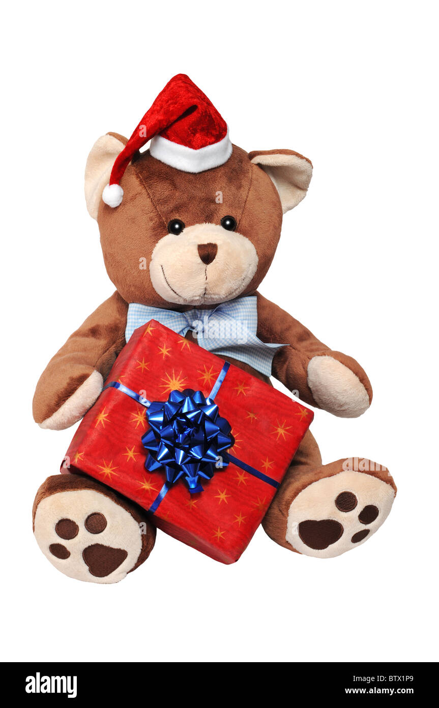 Christmas teddy bear with a gift isolated on white background. Stock Photo
