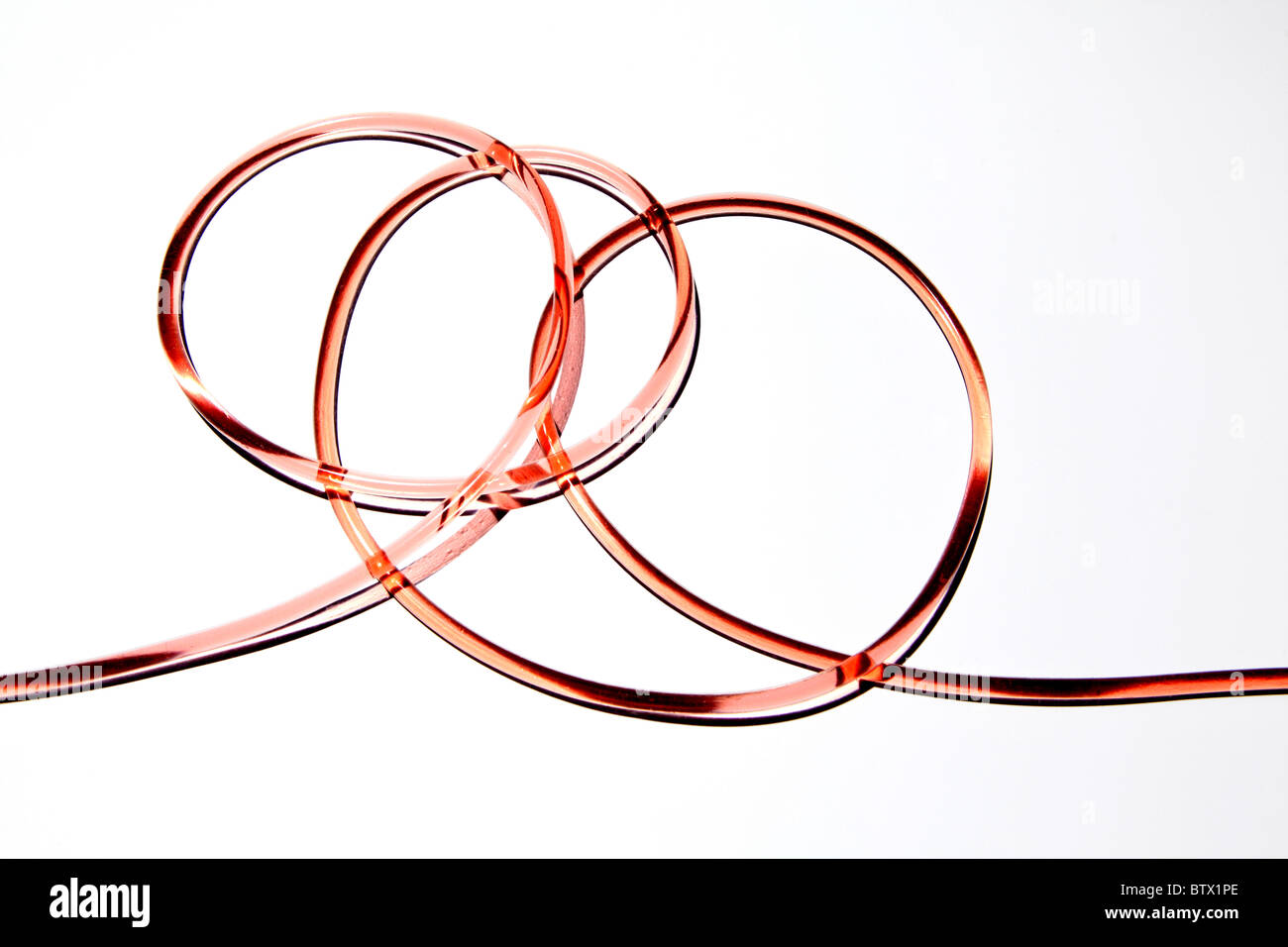 Clear rubber medical tubing with blood flowing through. Tubing is