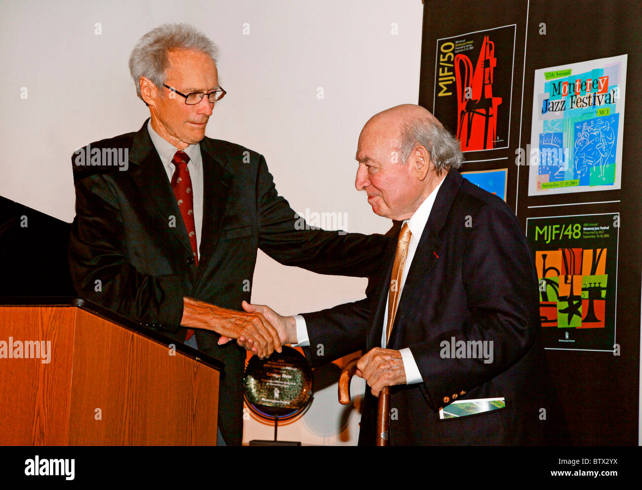 CLINT EASTWOOD presents GEORGE WEIN with an award at a Monterey Jazz Festival reception at the Mission Ranch CARMEL CALIFORNIA Stock Photo