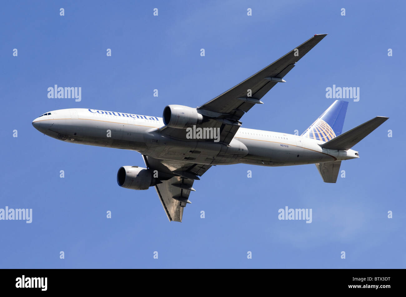 Boeing 777 operated by Continental Airlines climbing out after taking off from London Heathrow Airport Stock Photo
