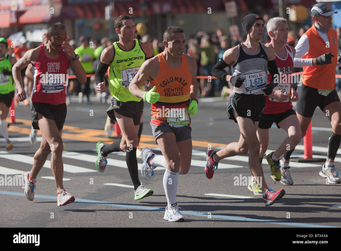 Indalecio Rodriguez (7230), Andy Gardner (1414), William Pedraza (755), Britton Costa (1679), and Thomas Noonan (730) in the New York City Marathon. Stock Photo