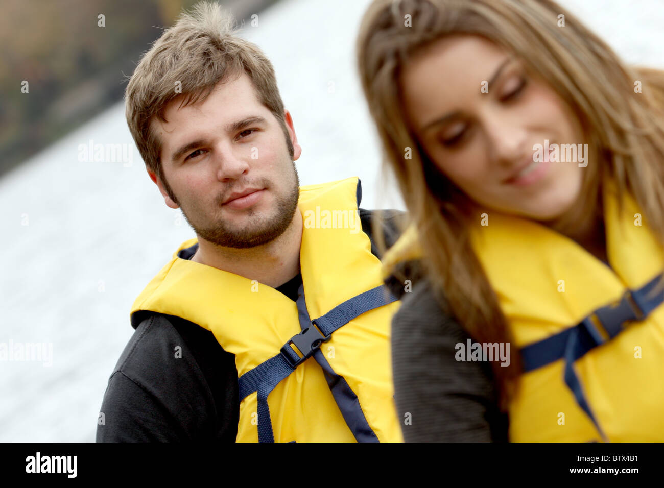 Young couple in a Canoe in life jackets Stock Photo