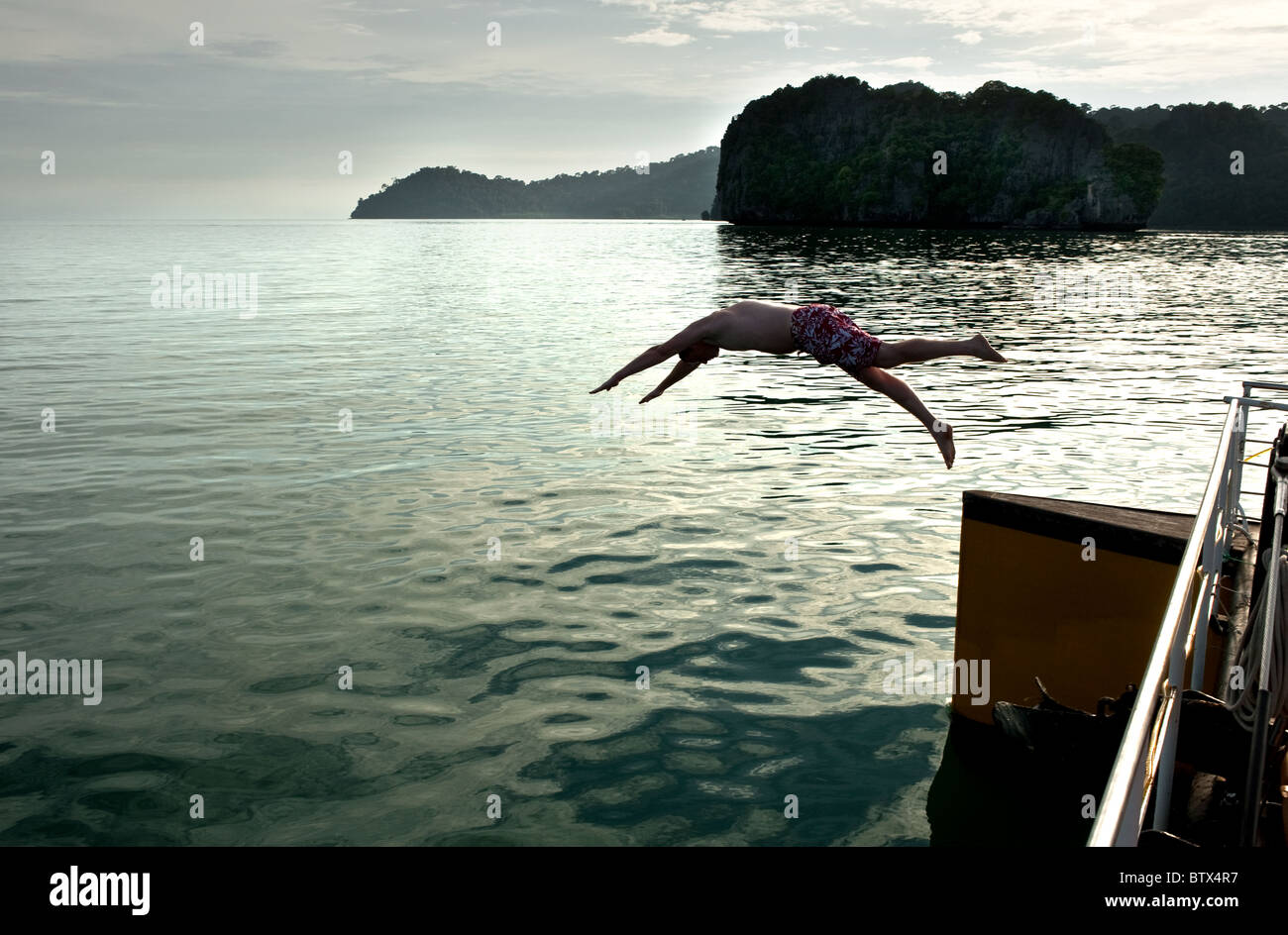 Man diving off boat hires stock photography and images Alamy
