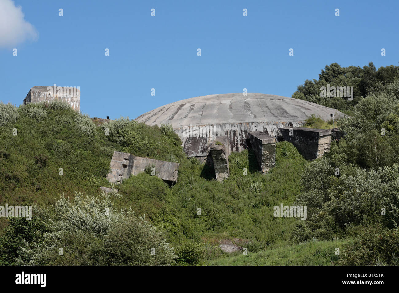 View of the massive concrete dome cupola over the Wizernes V2 site now the La Coupole Museum, Wizernes, near St Omer, France. Stock Photo