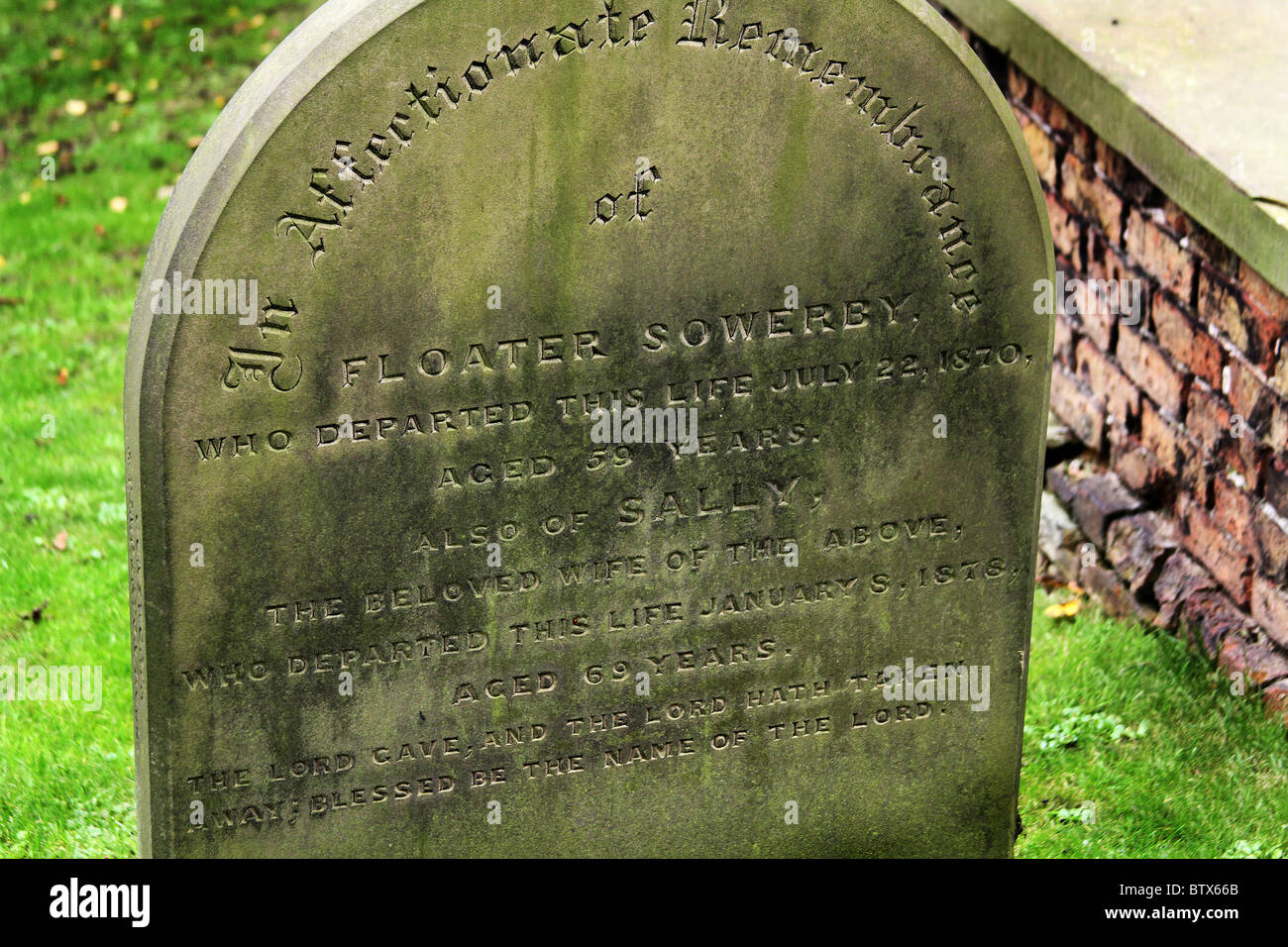 Old grave stones with inscriptions in the church yard in Hornsea, North ...