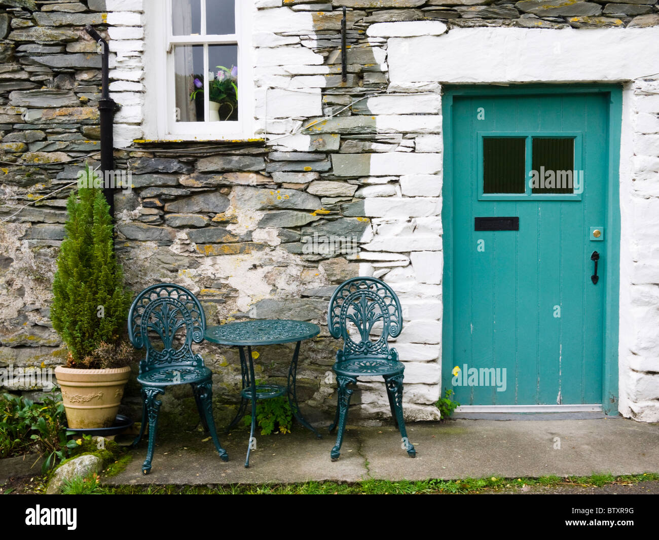 A traditional slate built cottage at Little Langdale in the Lake District National Park, Cumbria England. Stock Photo
