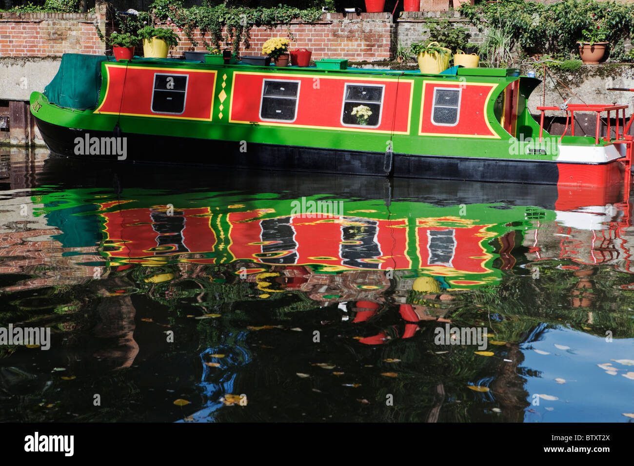 Canal boat reflection on river Lea at Ware Hertfordsire England Stock Photo