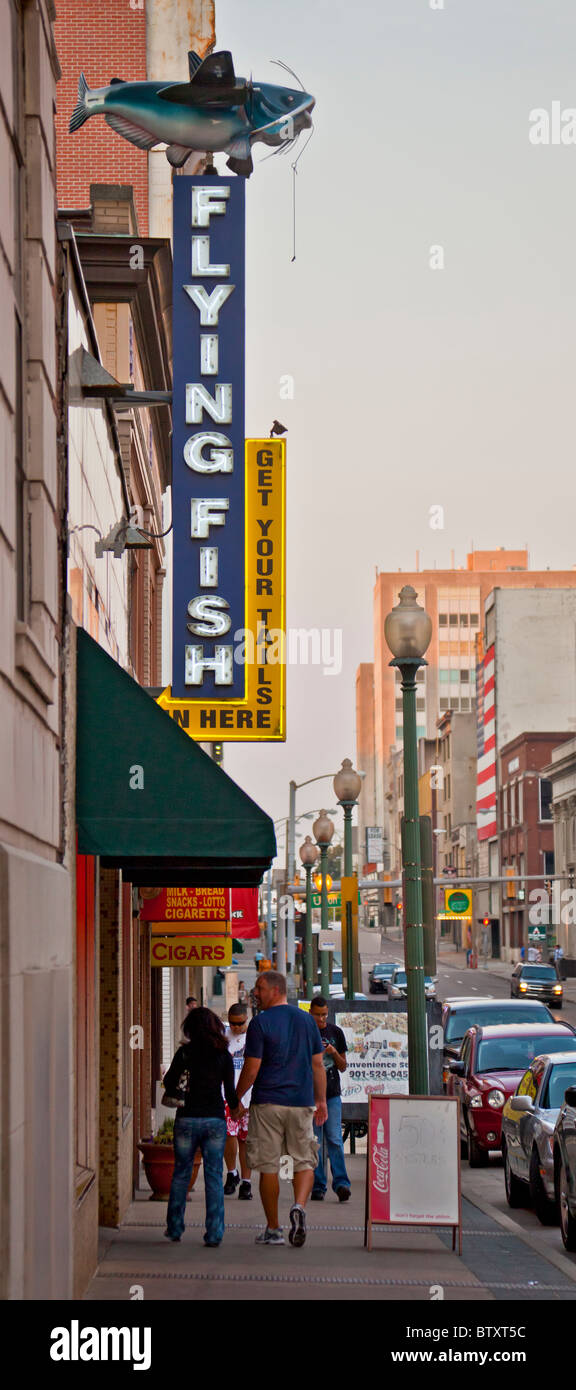 Sign and pavement/sidewalk outside the Flying Fish restaurant, South