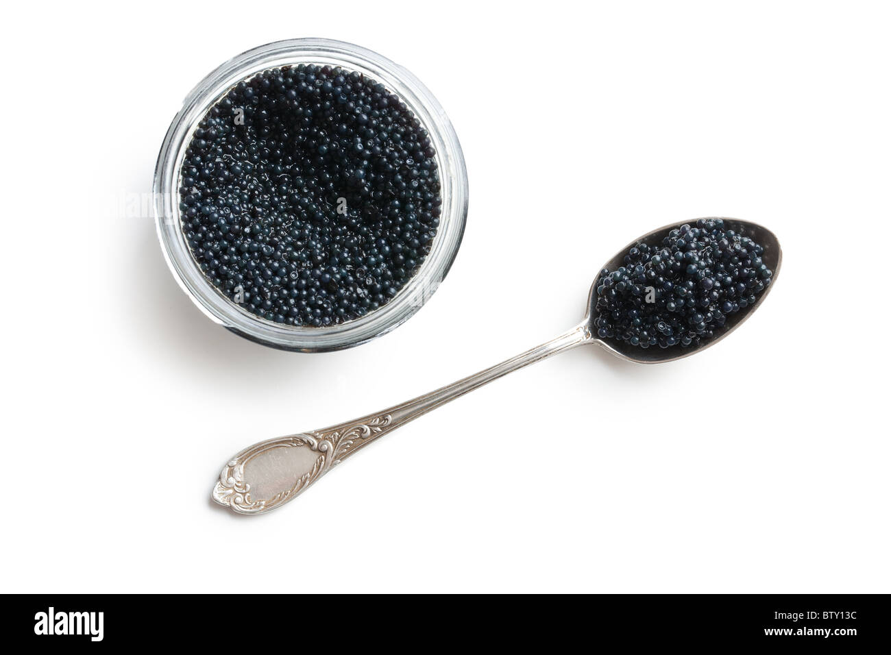 black caviar in spoon on white background Stock Photo