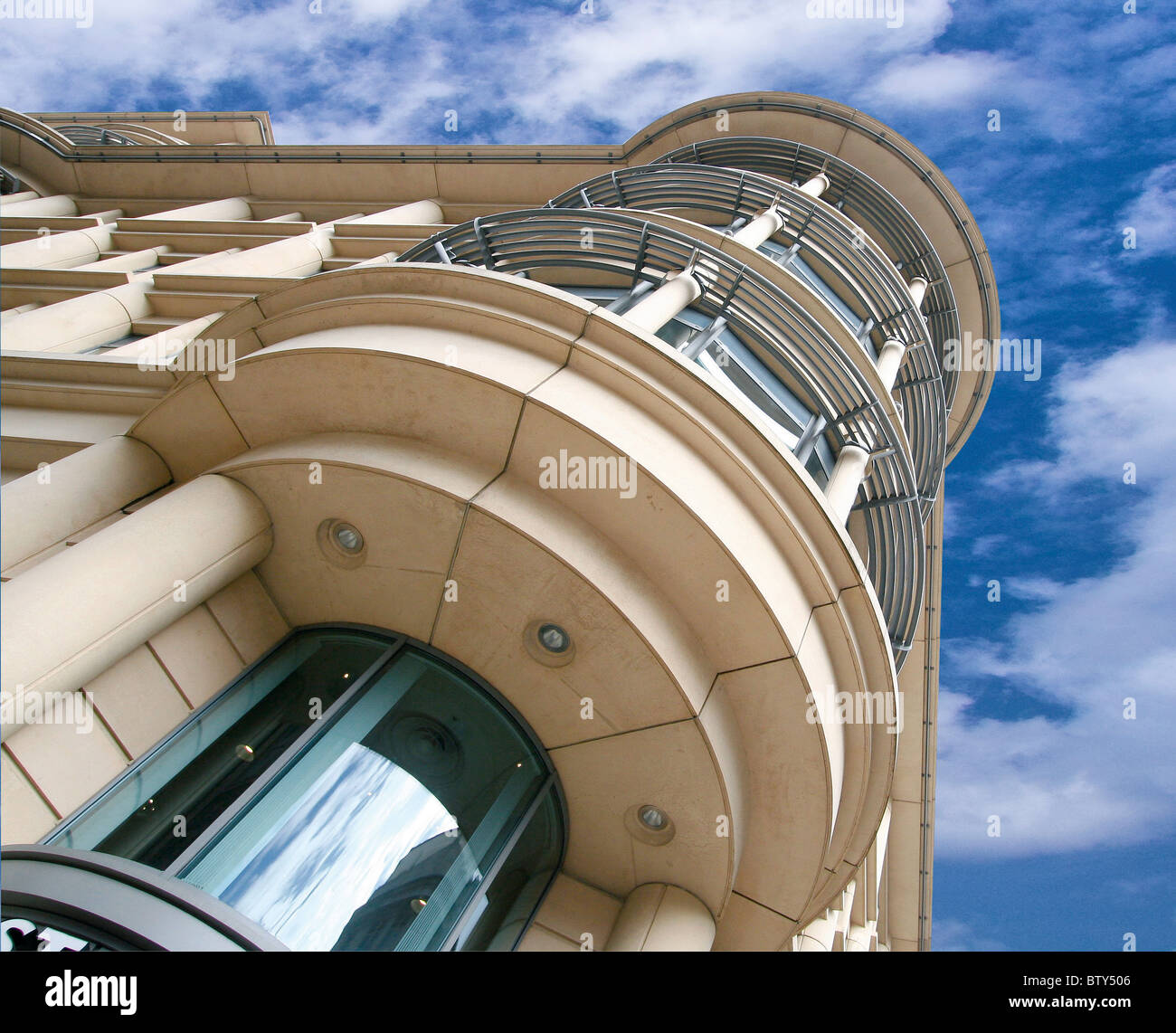 Looking skywards at buildings with a blue sky background Stock Photo