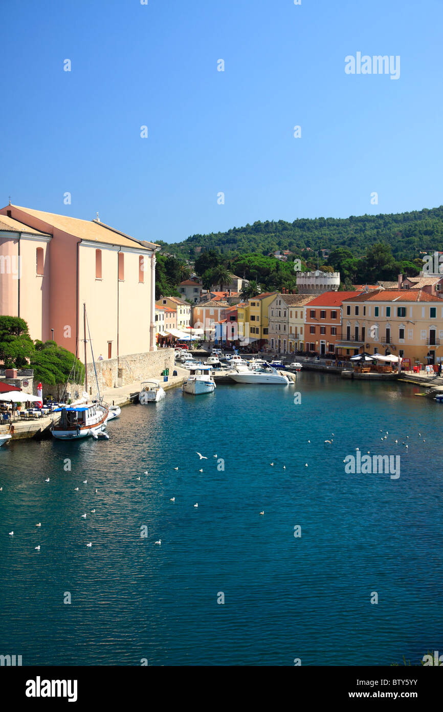 Colorful houses surrounding picturesque little port of Veli Losinj on Losinj Island, Croatia Stock Photo