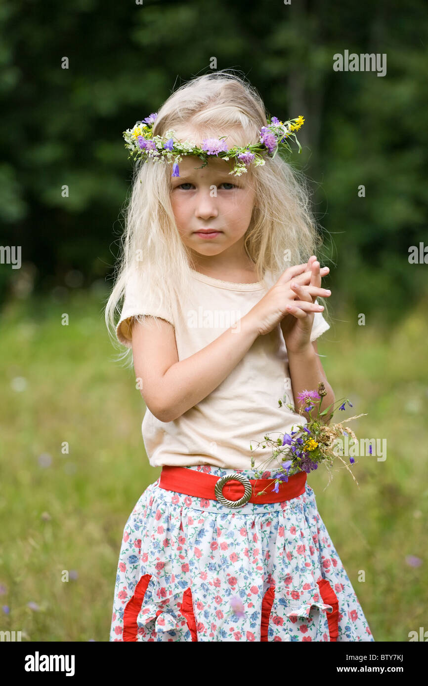 little beautiful girl in wild flowers wreath Stock Photo Alamy