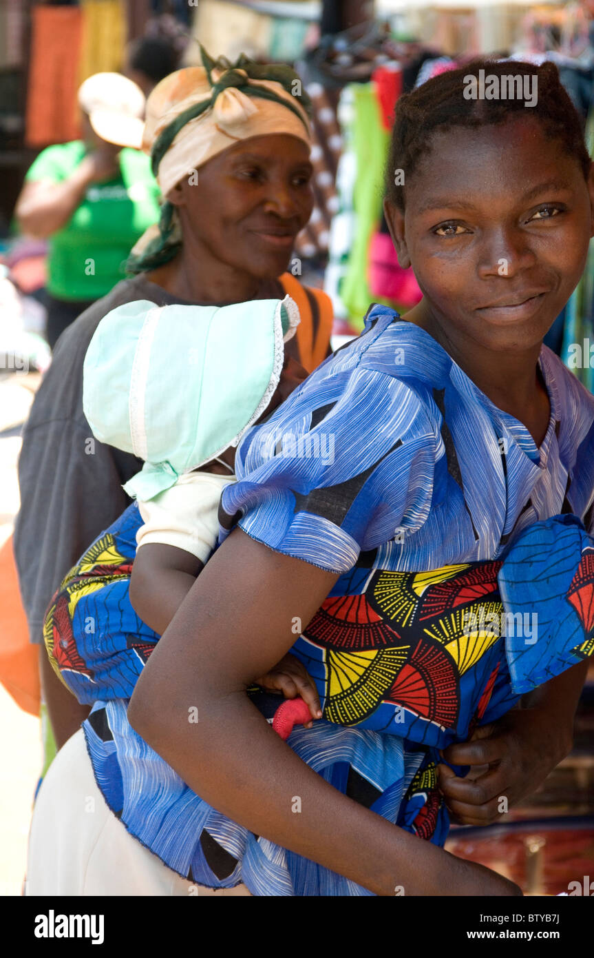 Women and children in a street market outside Victoria Falls, Zimbabwe Stock Photo