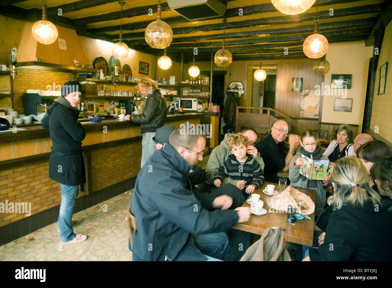 French families having coffee in a cafe in the market town of Coulommiers,   ile de france Northern France Stock Photo