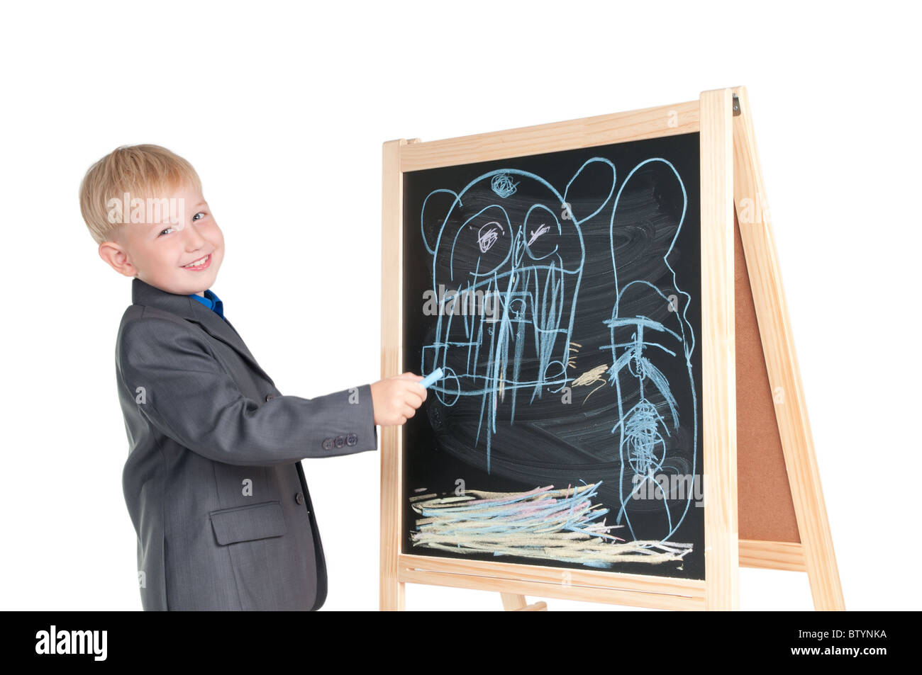 Smiling boy showing the drawing he made on a blackboard Stock Photo