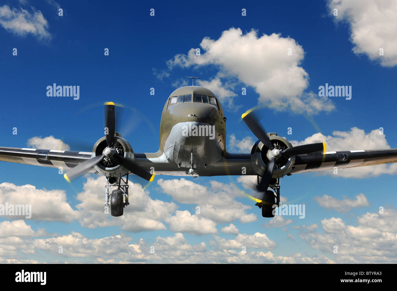 Vintage C-47 airplane landing during sunny bright day Stock Photo