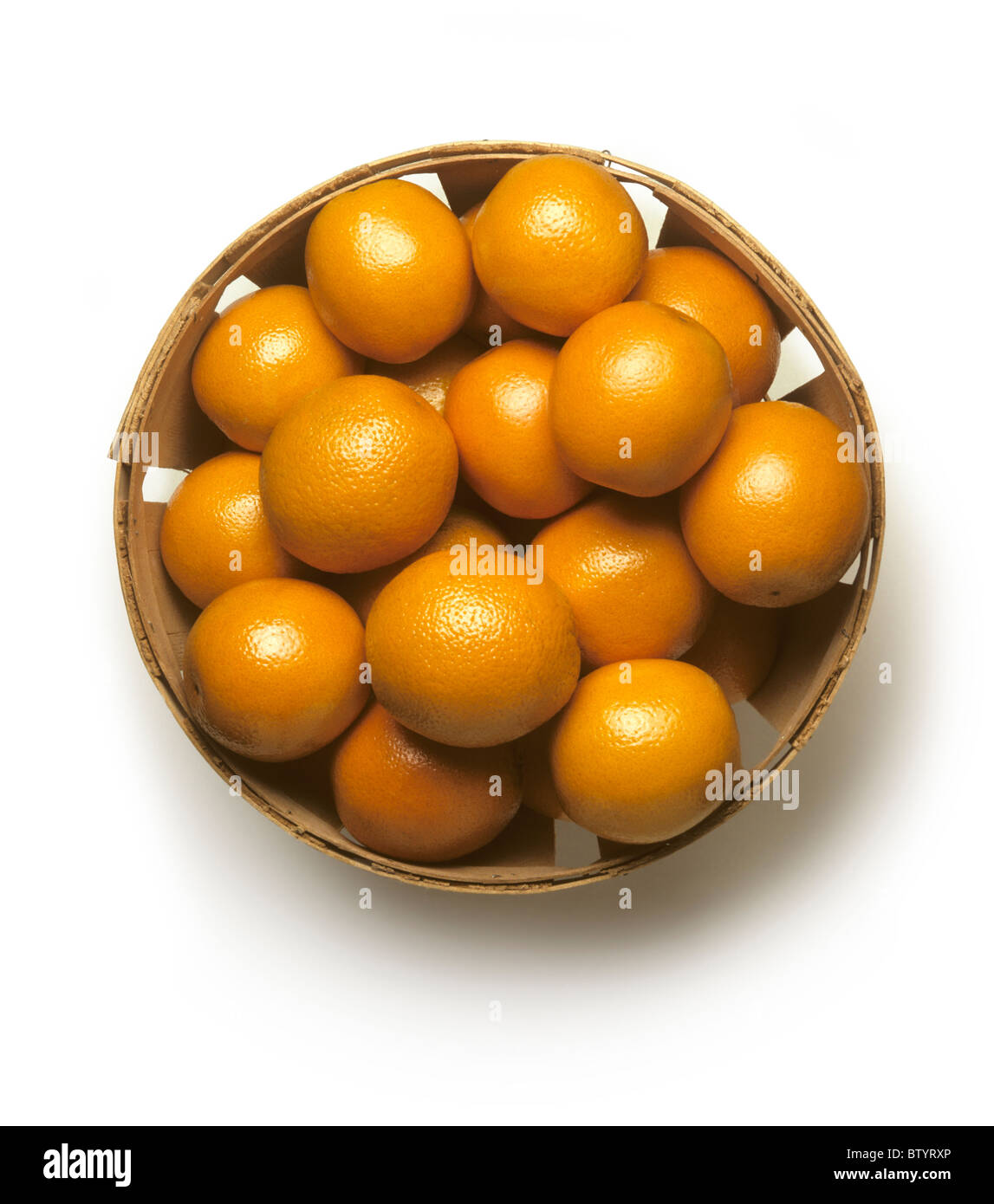 Bushel basket of fresh California oranges on a white background Stock Photo