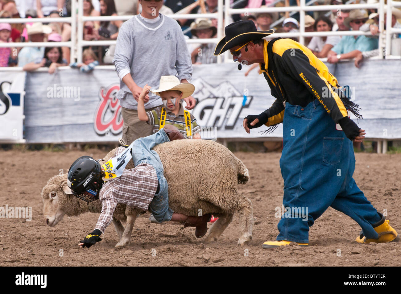 Mutton busting event, children riding sheep, Strathmore Heritage Days