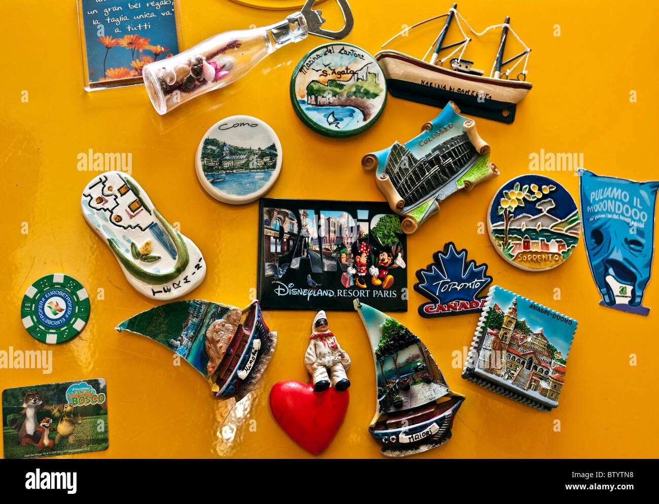 travel souvenir on a yellow fridge Stock Photo Alamy