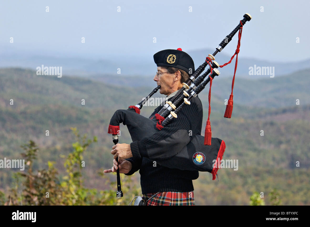 Man Playing Bagpipes at Overlook on the Cherohala Skyway in Monroe County in Tennessee Stock Photo