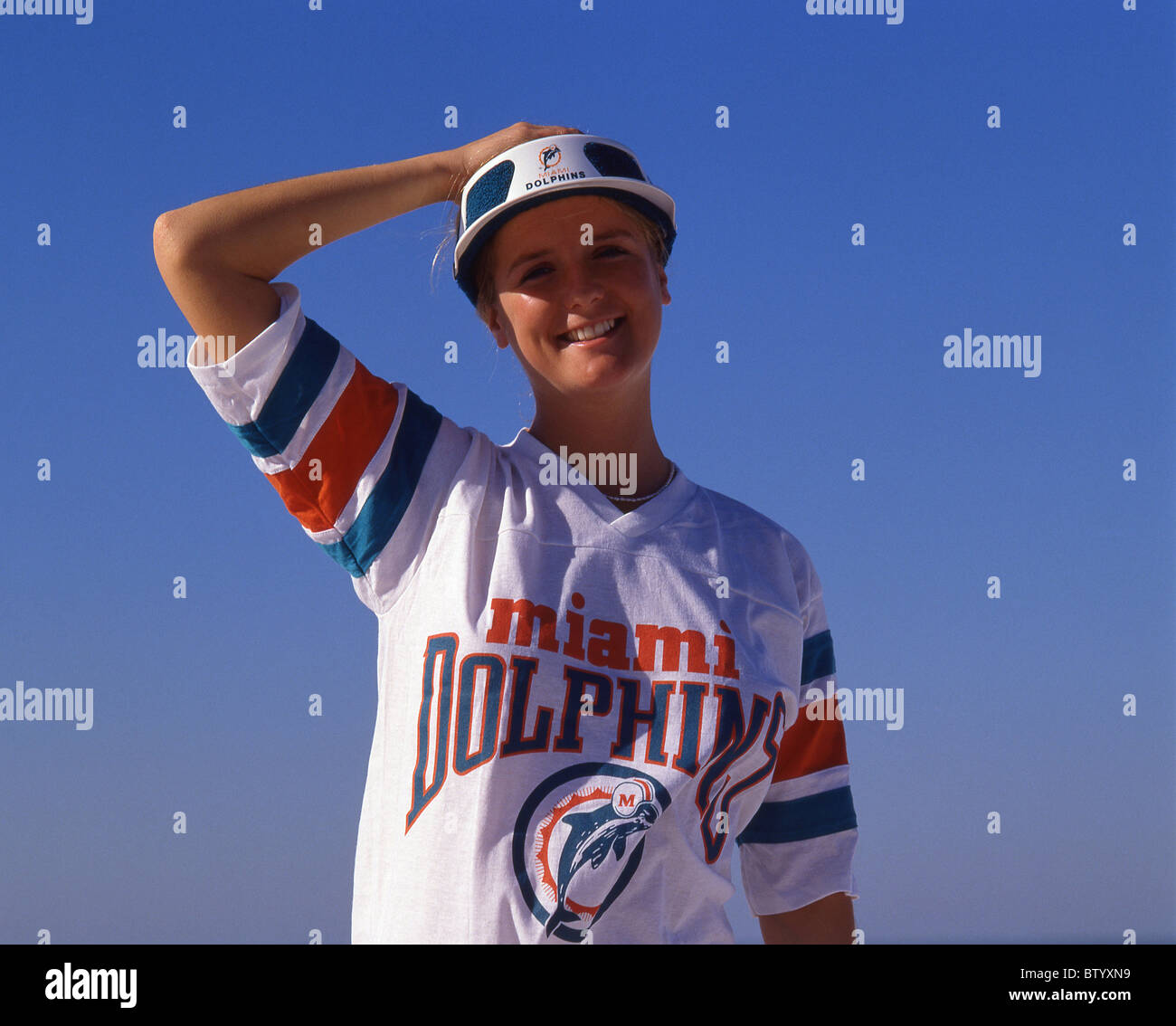 Young woman in Miami Dolphin's T-shirt, Miami Beach, Florida, United States of America Stock Photo