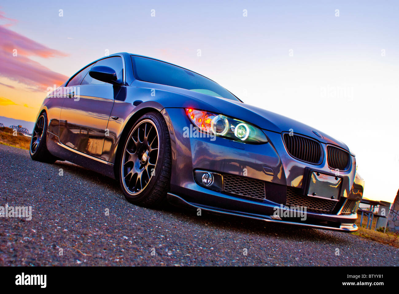 BMW 335i shout outdoors at sunset Stock Photo - Alamy
