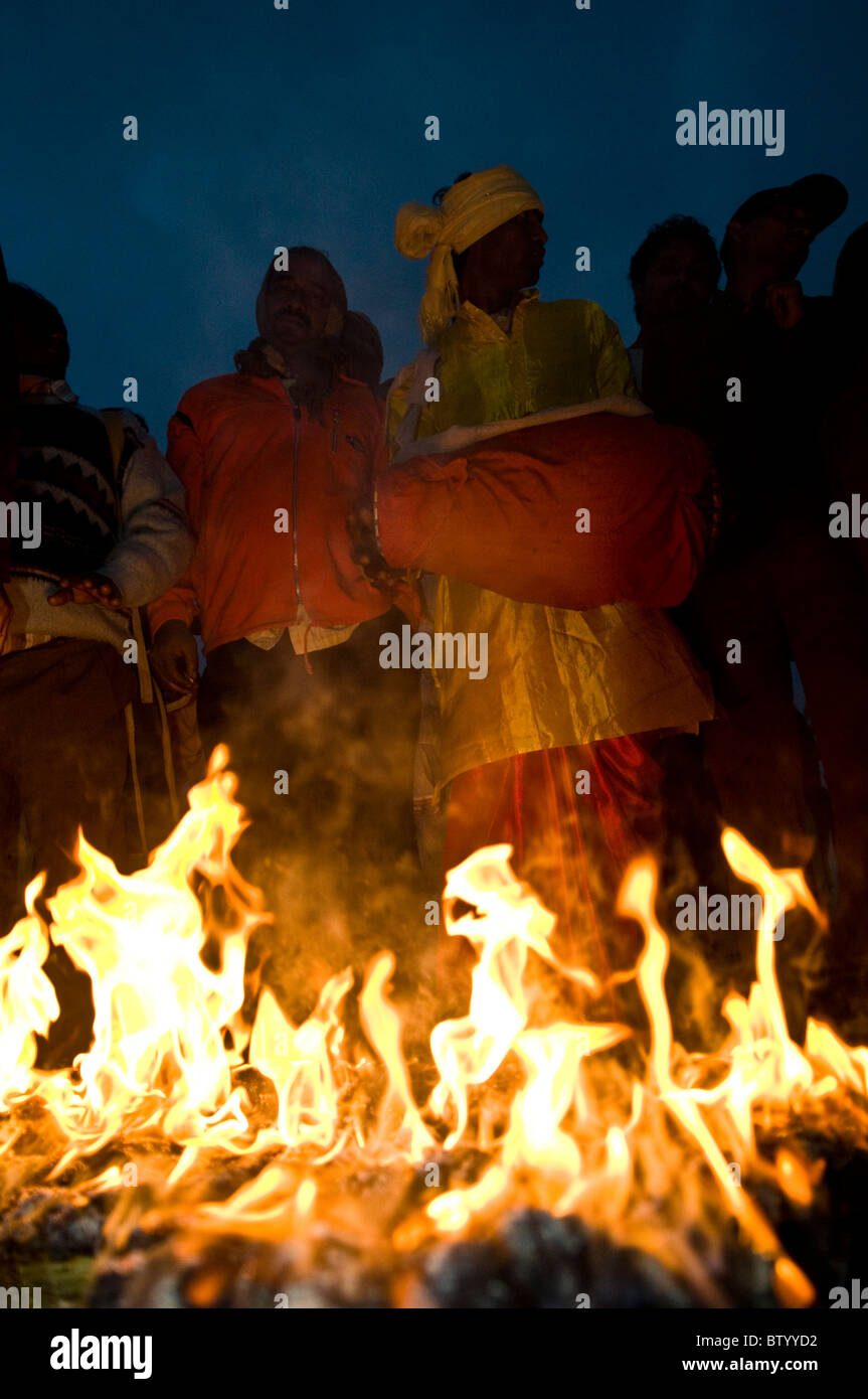 Indian festival musician playing a traditional drum during the Gangasagar mela. Stock Photo