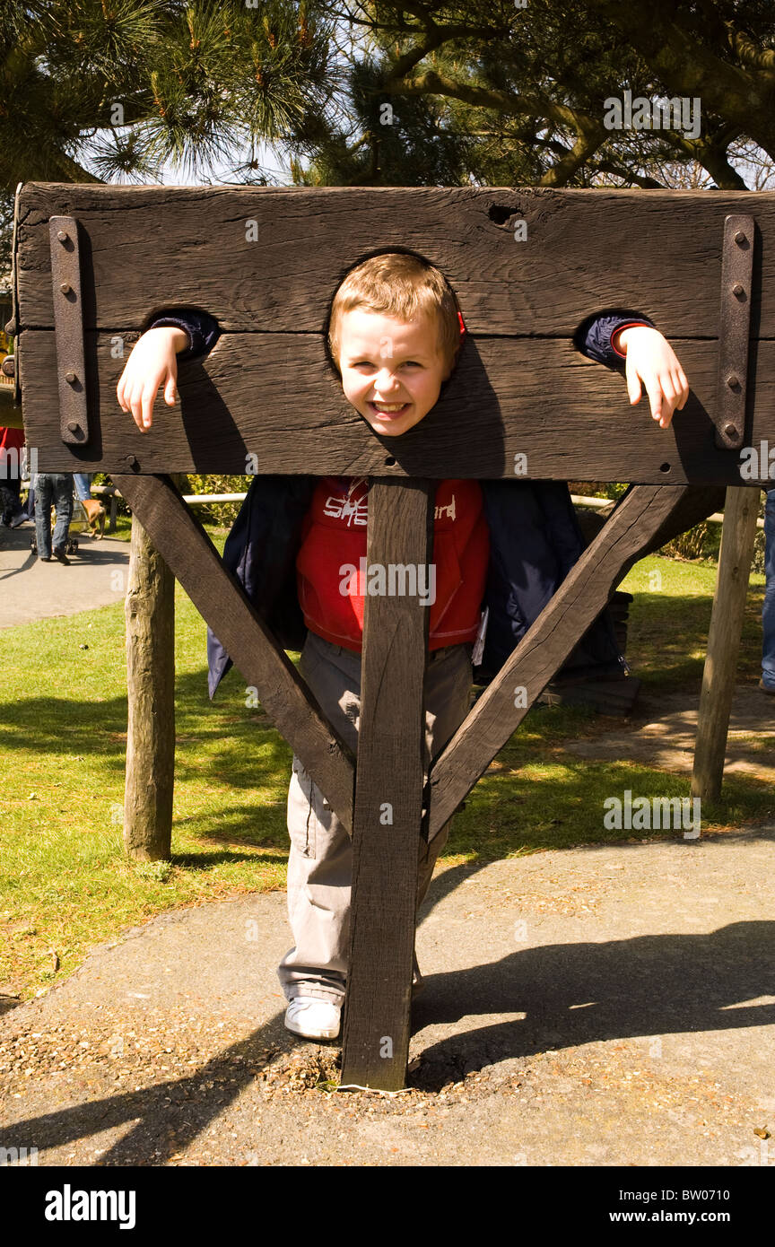 A child in stocks Stock Photo Alamy