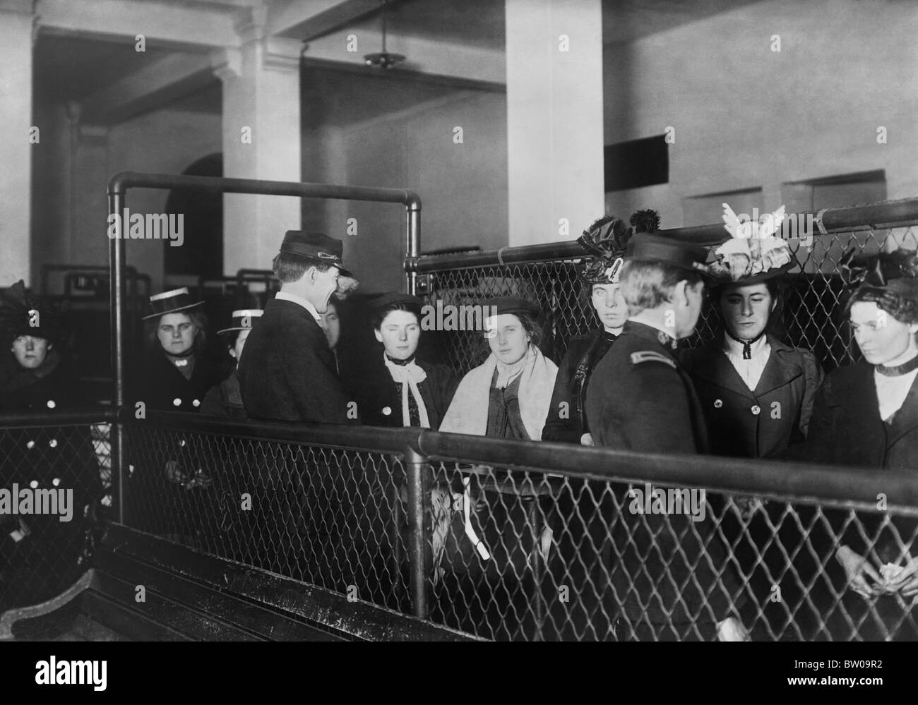 Vintage photo circa 1907 of female immigrants being processed at Ellis Island in New York. Stock Photo