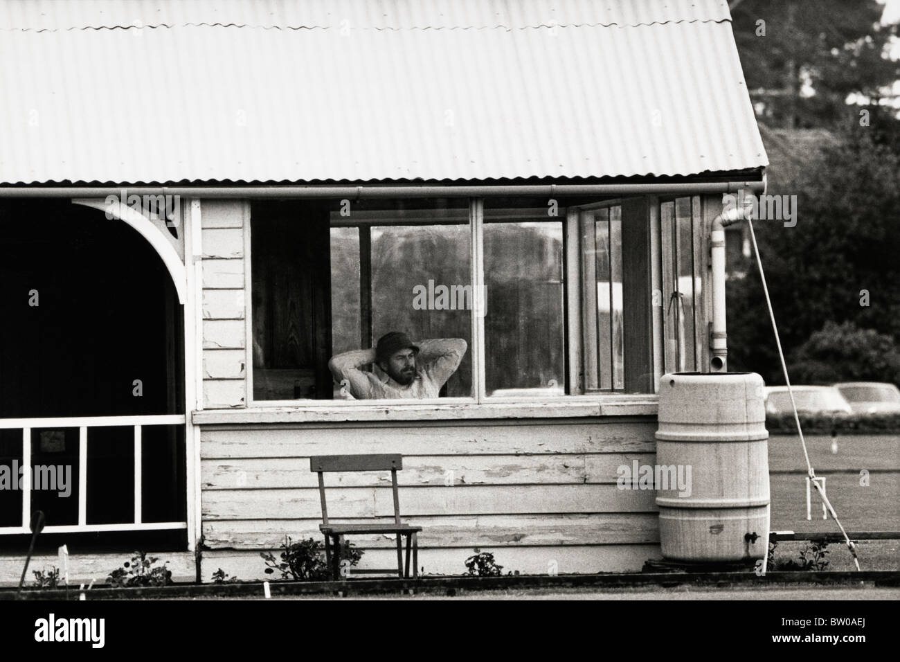 Spectator watching Peel Memorial open croquet tournament at Cheltenham
