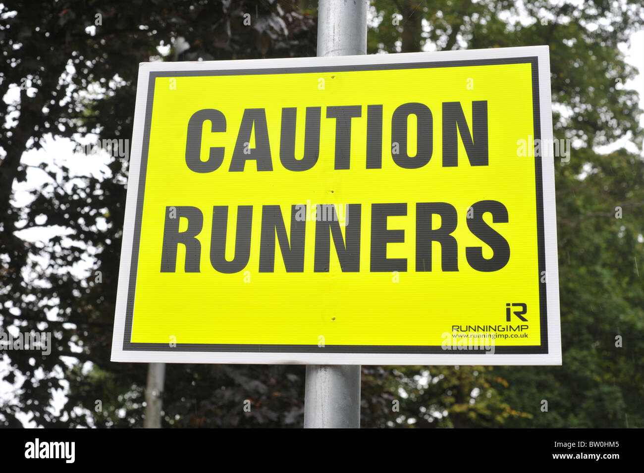 Sign Warning Traffic at running event Stock Photo