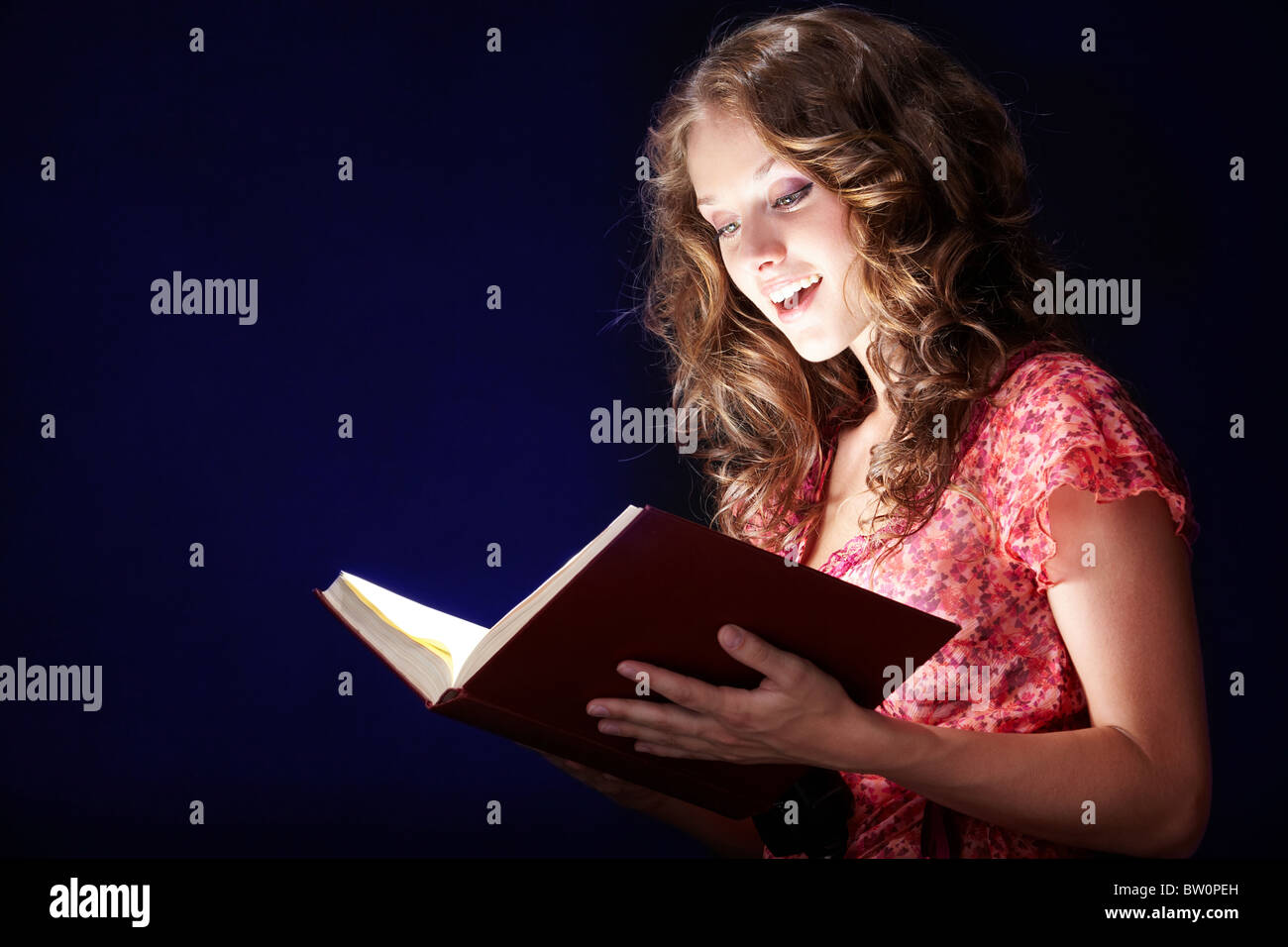 Love Potion Leaning On A Book Of Spells Stock Photo - Download