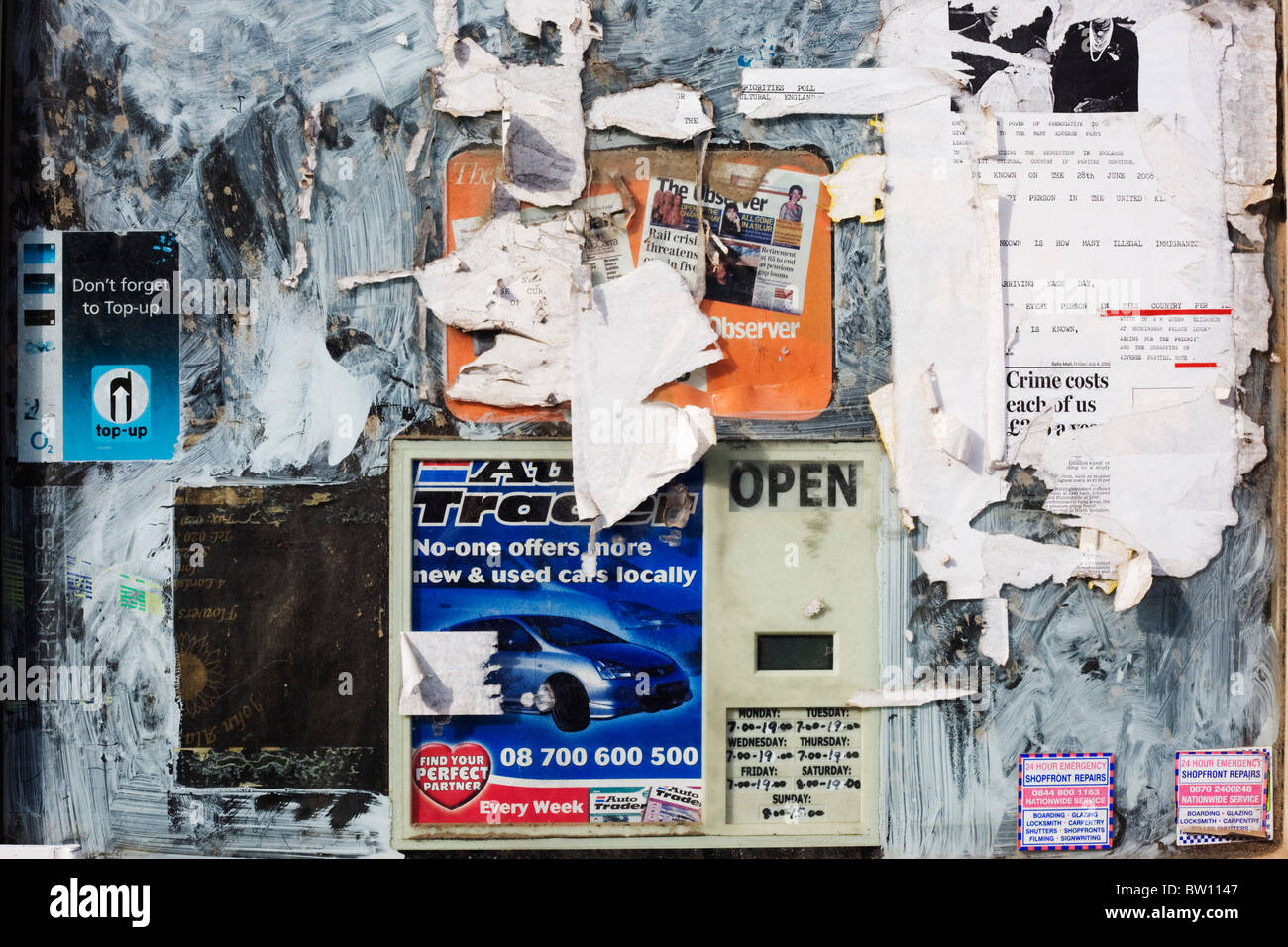 Smeared emulsion and commercial paper stuck to a window of an East