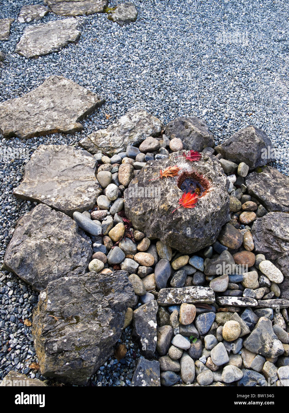 A Tsukubai Or Stone Basin In A Japanese Garden With Pebbles Stone