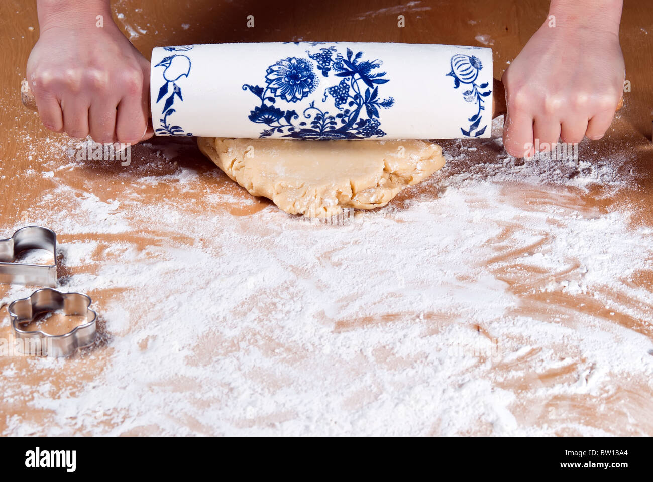 Roll out the dough with a rolling pin with flour Stock Photo Alamy