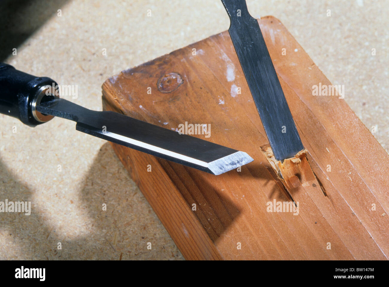 chisel cut carve wood shave shape sharp metal edge blade strong steel tool  woodworking shop hand Stock Photo - Alamy