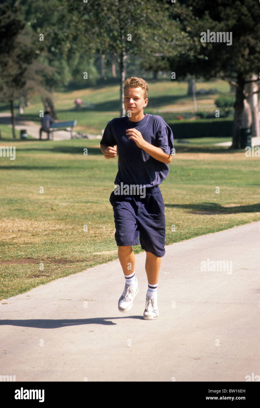 runner cramp warm up jog exercise park sidewalk Stock Photo Alamy