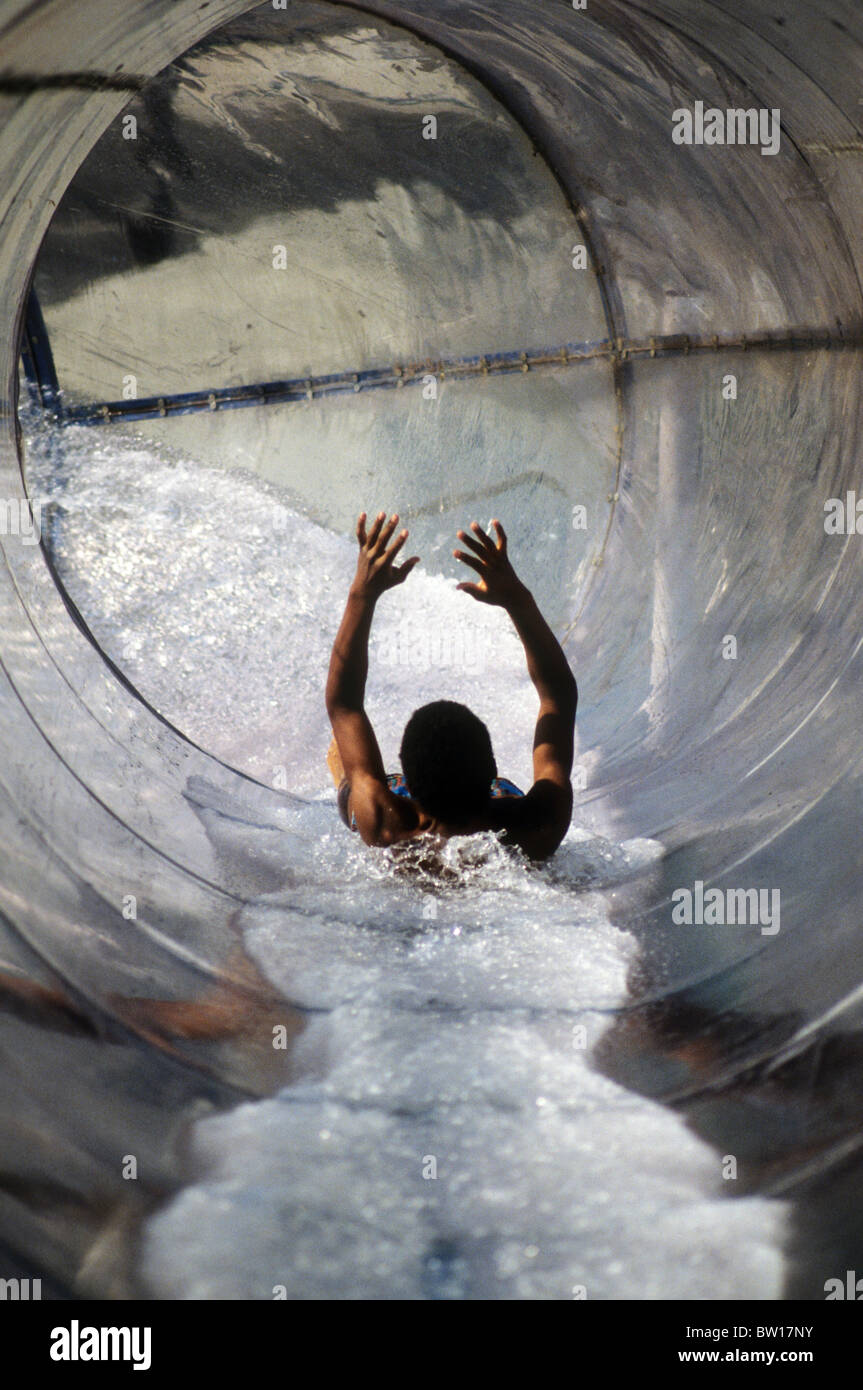teen boy male waterslide water slide fun thrill tube excite swim suit speedo  shirtless fast speed splash Stock Photo - Alamy