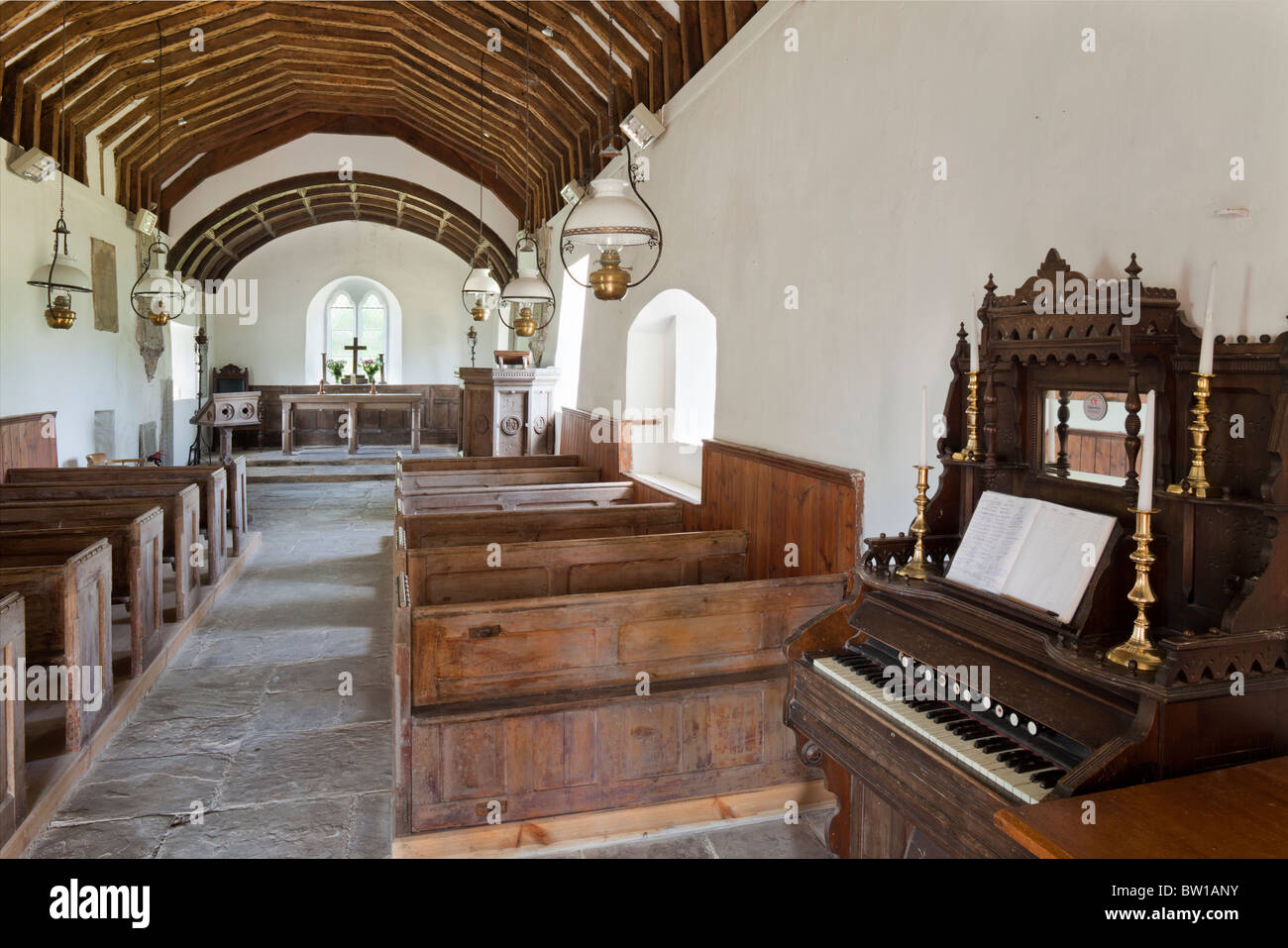 The simple, largely unspoilt, interior of 14th century St Marys church, Llanywern, Powys, Wales Stock Photo