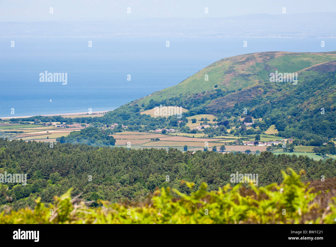 A telephoto view of Porlock Bay, the Exmoor village of Bossington and Bossington Hill from Dunkery Hill, Somerset Stock Photo
