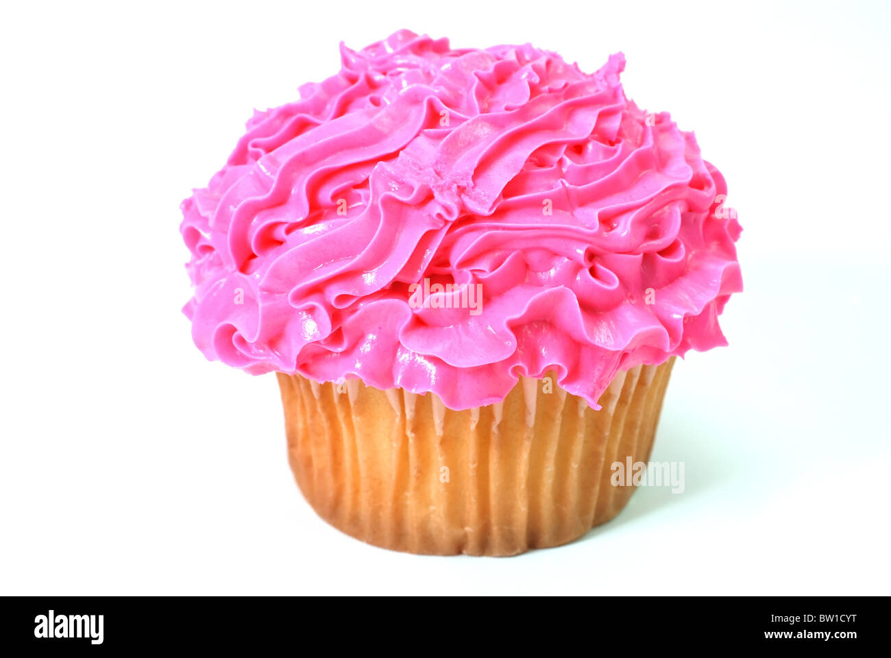 Cupcake with pink decorative frosting. Isolated on white background