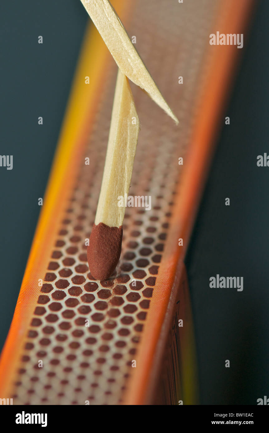 Broken match on matchbox striker pad Stock Photo Alamy