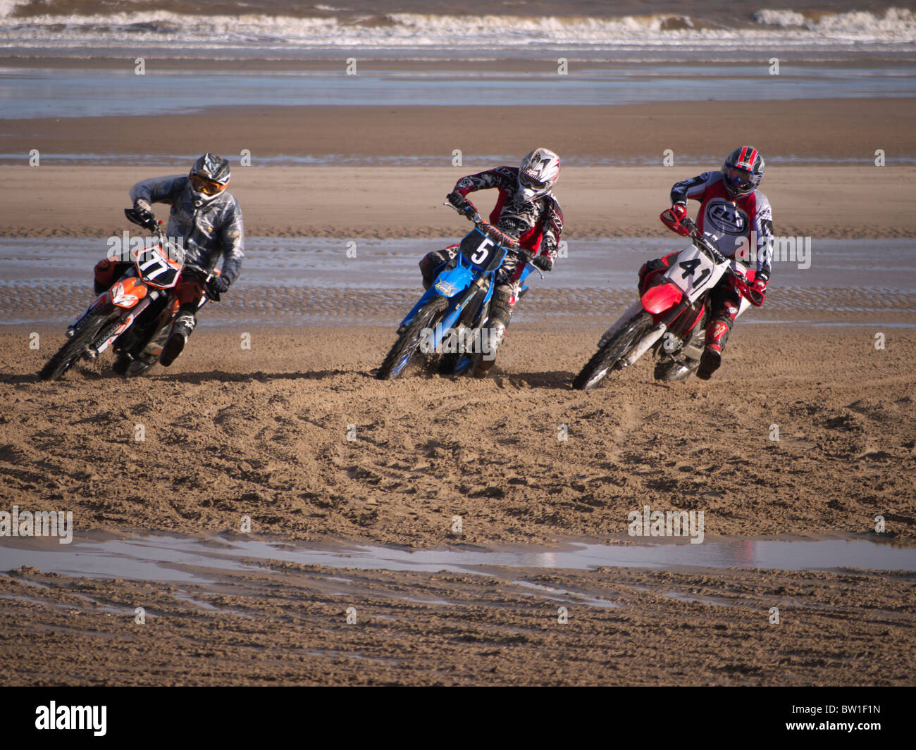 Threee bikes taking part in the Beach racing at Mablethorpe Lincolnshire UK November 2010 Stock Photo