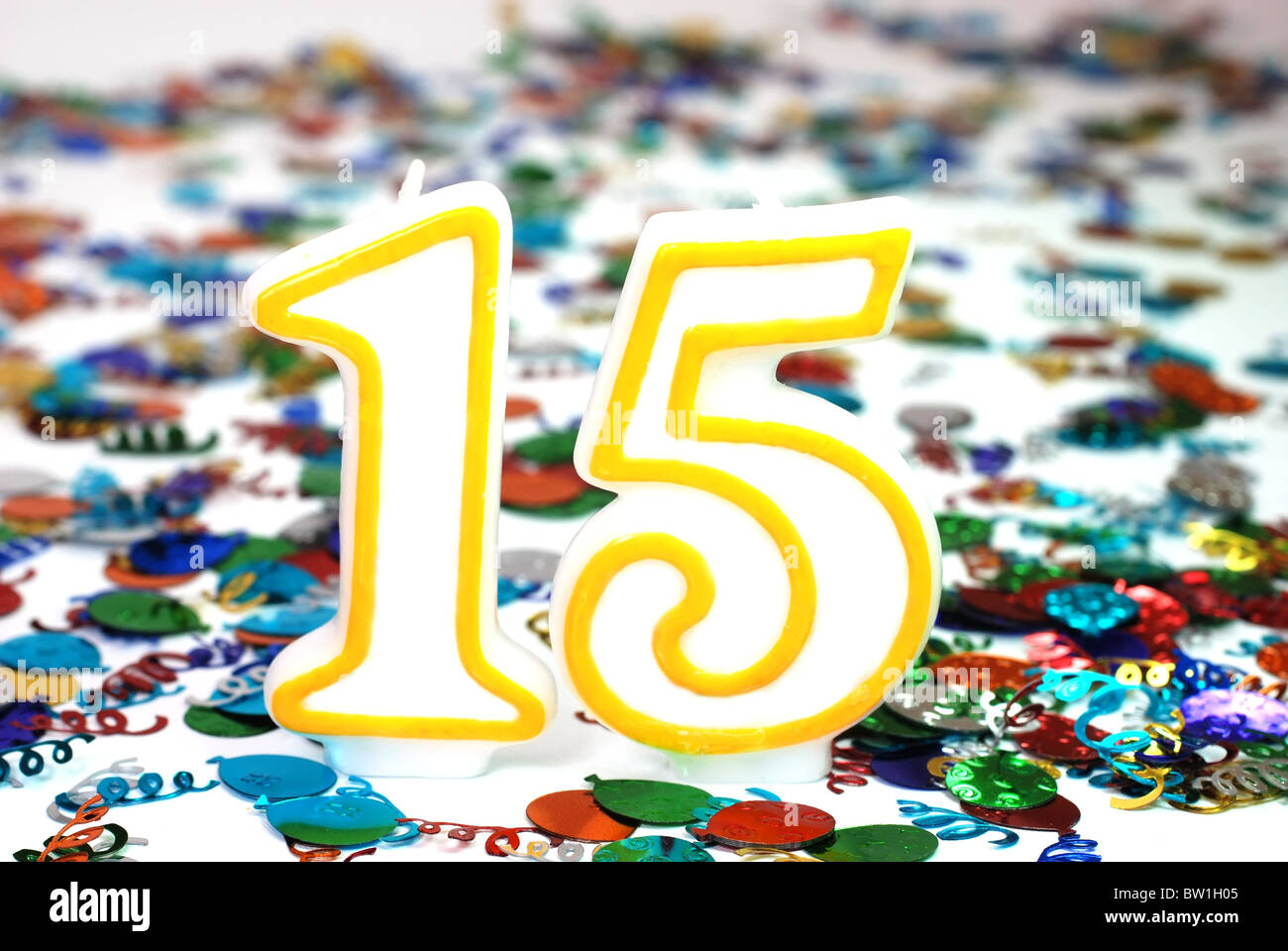 Number 15 celebration candle with confetti Stock Photo - Alamy