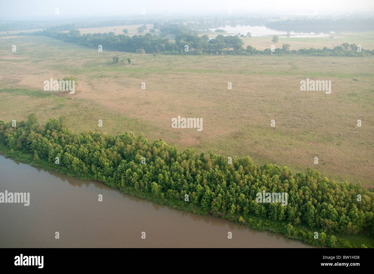 An aerial view of partly wooded grazing land beside the Red River of the South, near the city of Shreveport, in Northern Louisiana, United States. Stock Photo