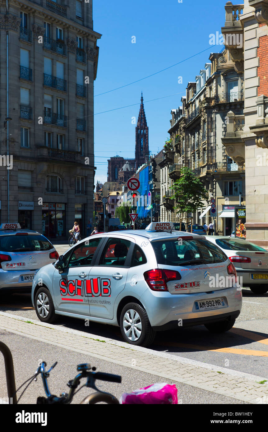 Parked driving school car, street, cathedral, Strasbourg, Alsace, France Stock Photo